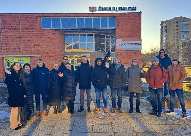 Cherry Servers employees in front of an building