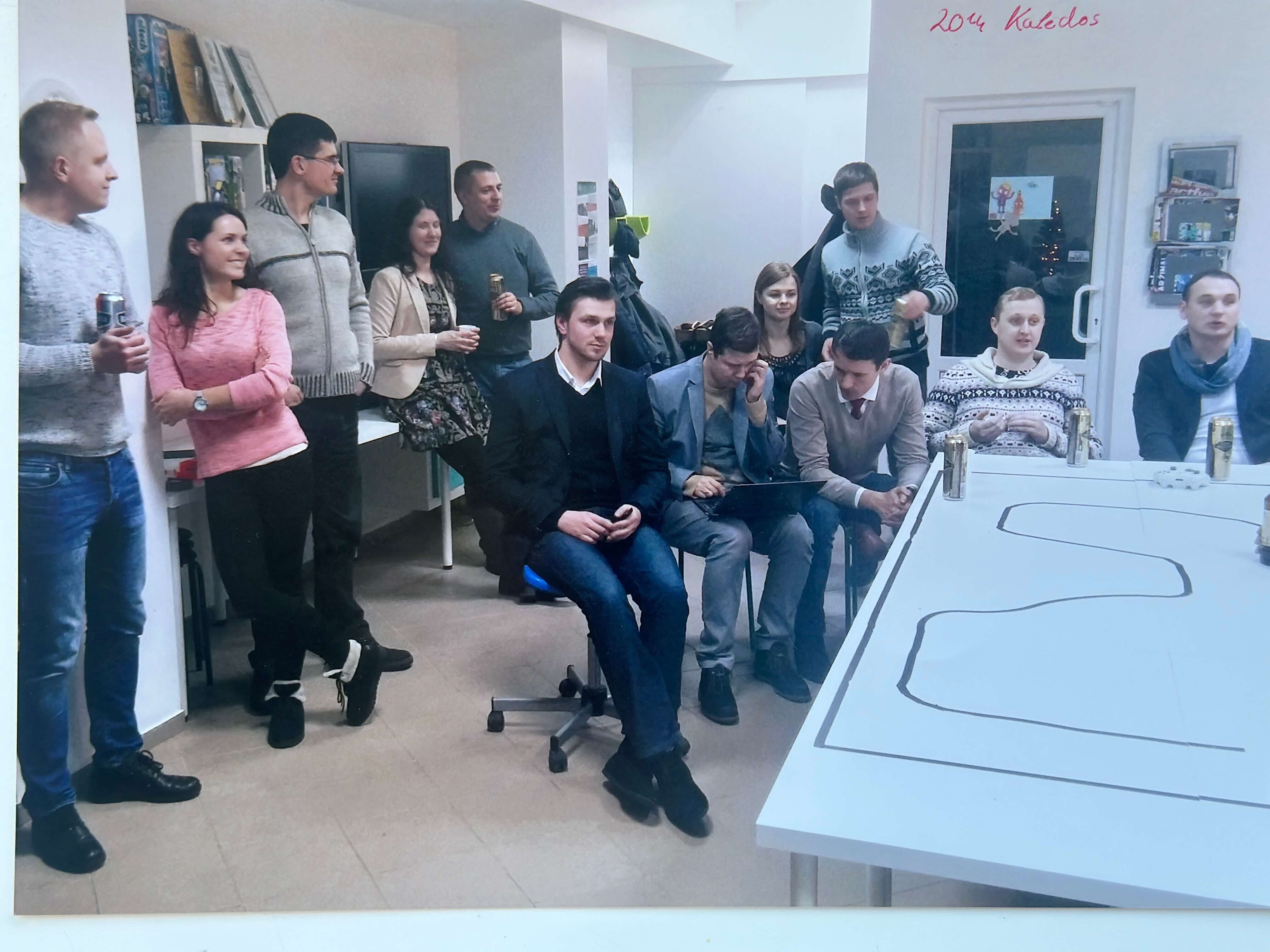 Cherry Servers employees in an office meeting room having a meeting